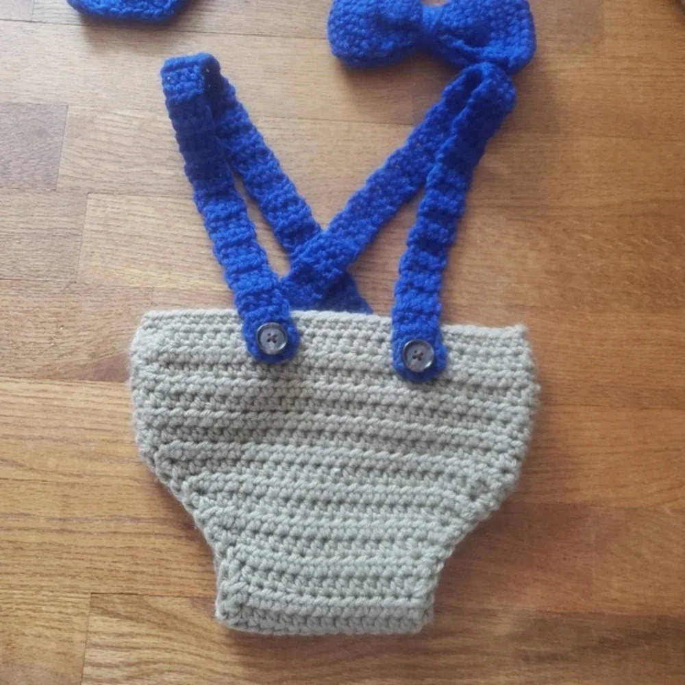 Beige diaper cover with blue‎ suspenders